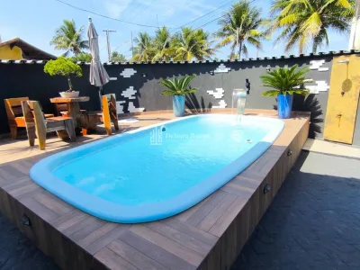 CASA COM PISCINA FRENTE MAR !!! 3 DORMITORIOS OTIMA LOCALIZAÇÃO